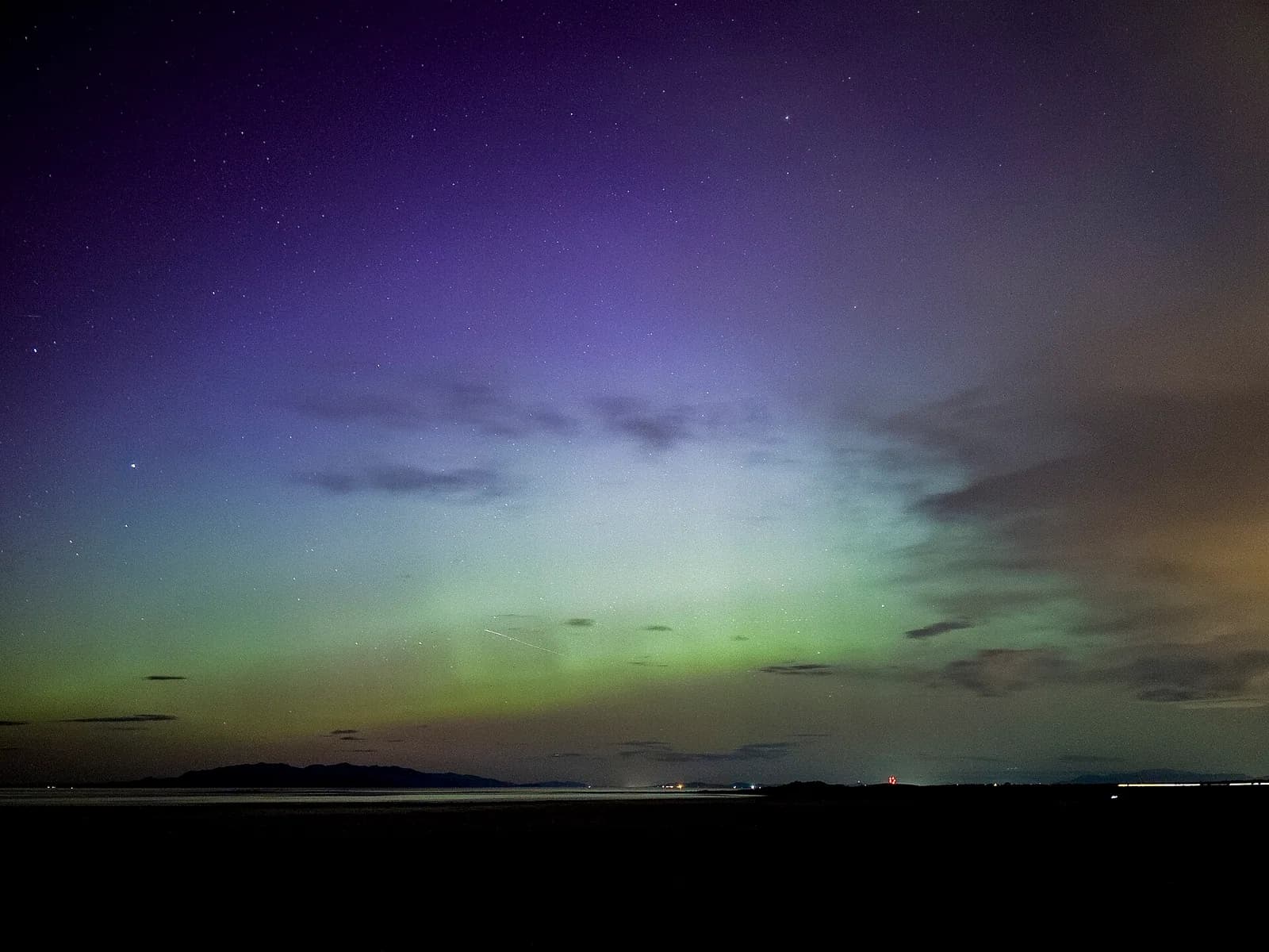 Aurora and stars above the Great Salt Lake from northern Antelope Island